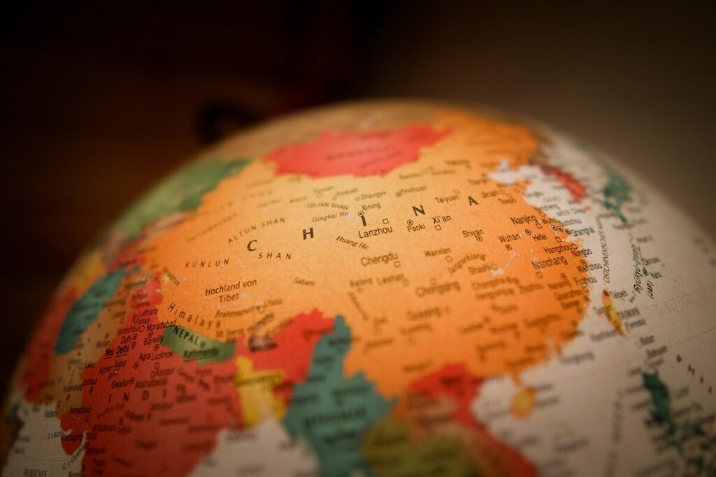 Close-up of a globe showing China and surrounding countries, with place names clearly visible.