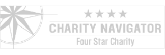 Charity Navigator logo: a grey and white star inside a circle is on the left. On the right, there are 4 grey star icons above grey text reading 'Charity Navigator; four star charity'.