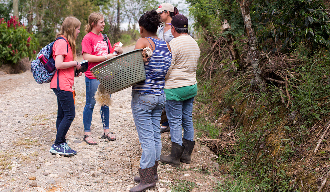 Women sharing the gospel while on a mission trip.