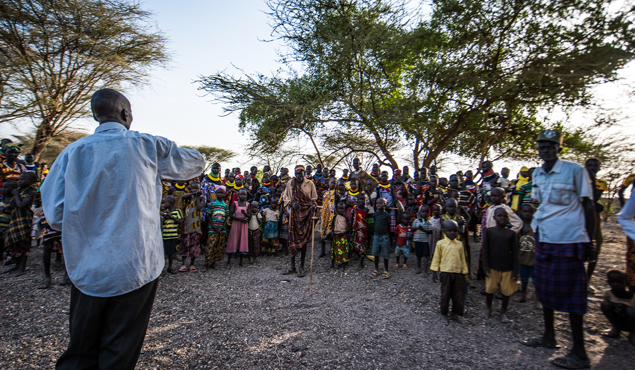 A pastor preaches to a church congregation in Africa.